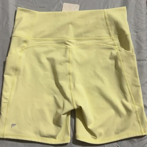Fabletics Pure Luxe High Waisted Pastel Yellow Bike Shorts 6” - Picture 2 of 6